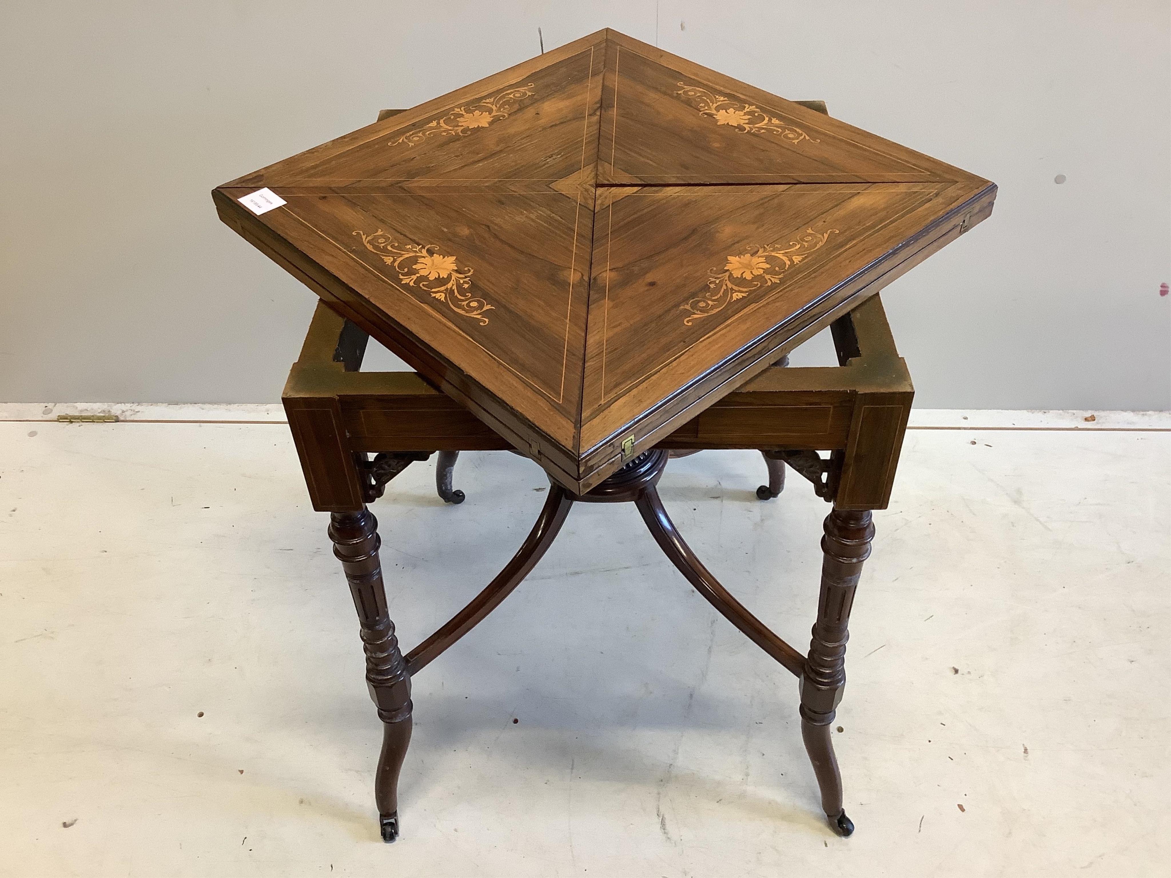 An Edwardian inlaid rosewood envelope card table, width 54cm, depth 54cm, height 74cm. Condition - fair